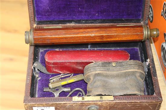 A telescope, binoculars, leather box etc